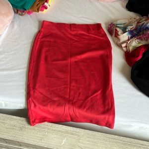 A reddish pink, pencil skirt, stretchy material